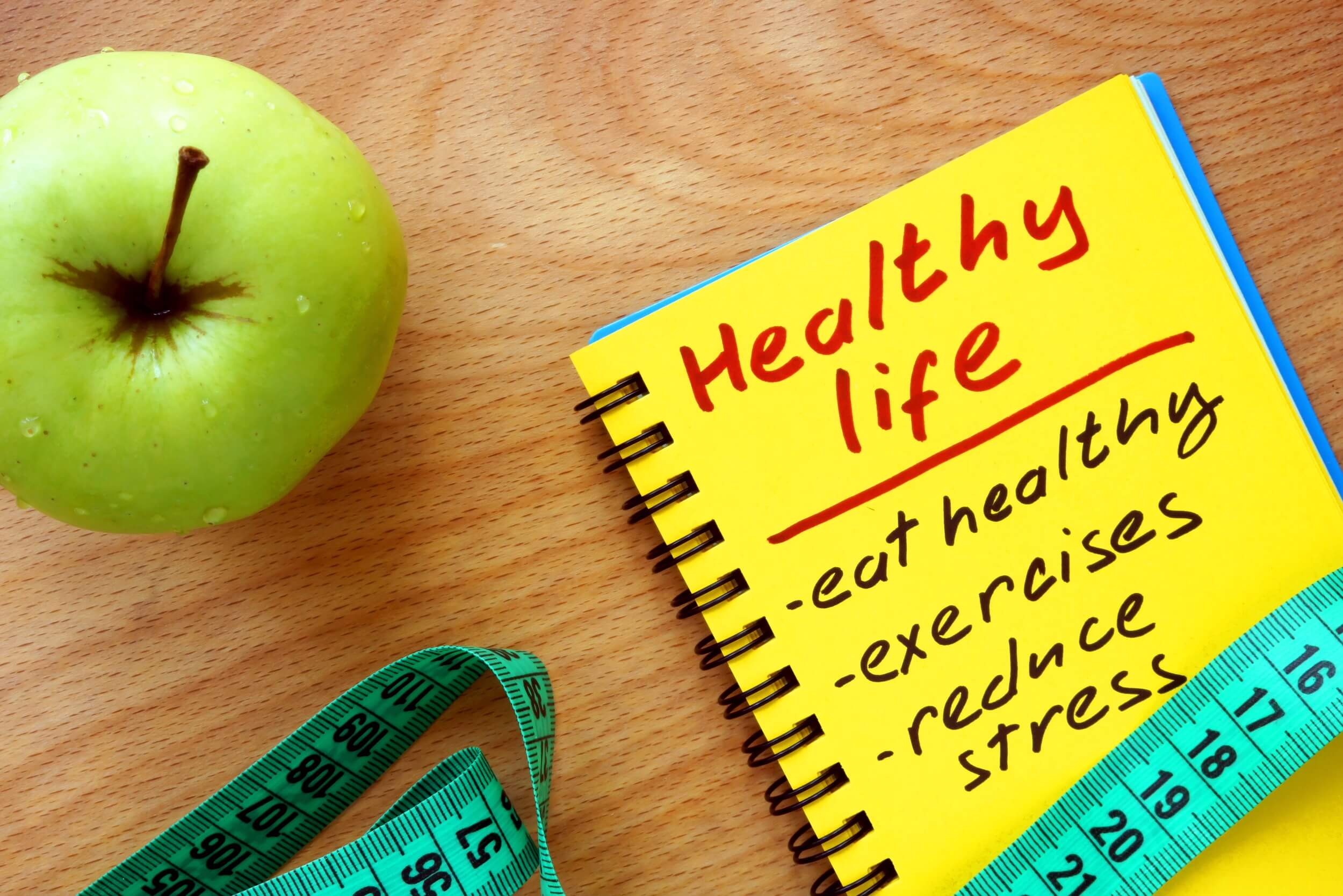Notepad with healthy life guide, apple and measure tape